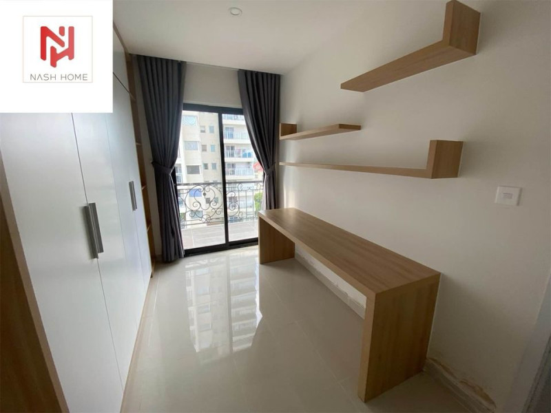 A Bright Two-Bedroom Living Space with Elegant Finishes