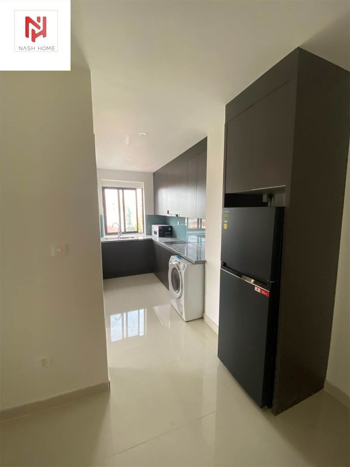 A Bright Two-Bedroom Living Space with Elegant Finishes